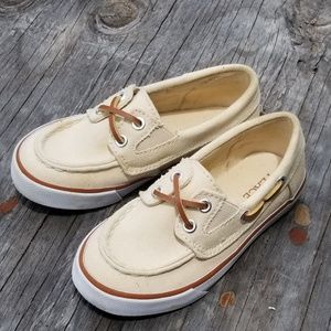 Children place boy shoes